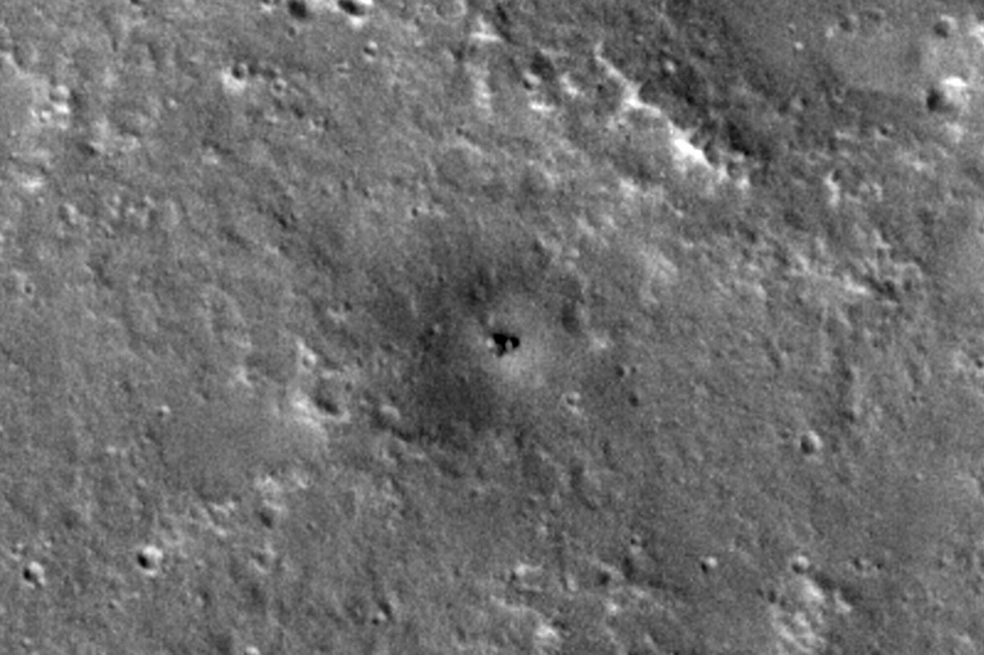 NASA's retired InSight lander collecting dust on the flat plains of Elysium Planitia.