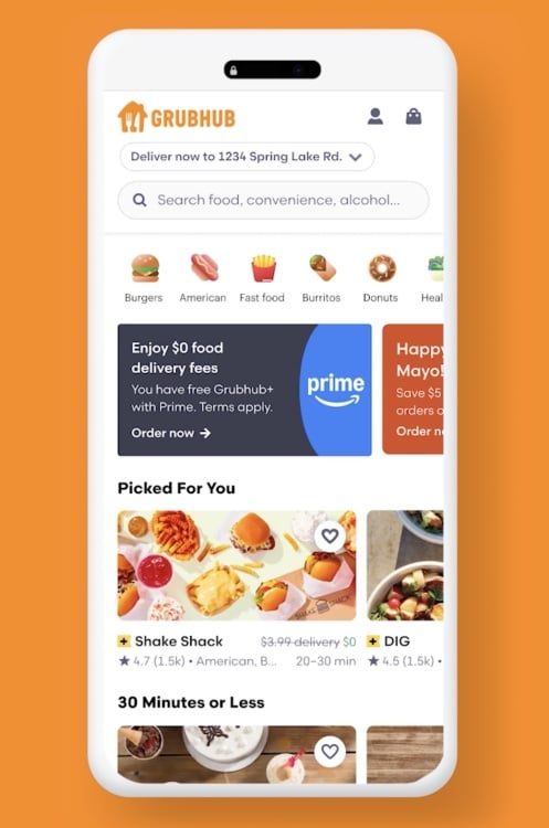 A phone displaying the Grubhub home page.
