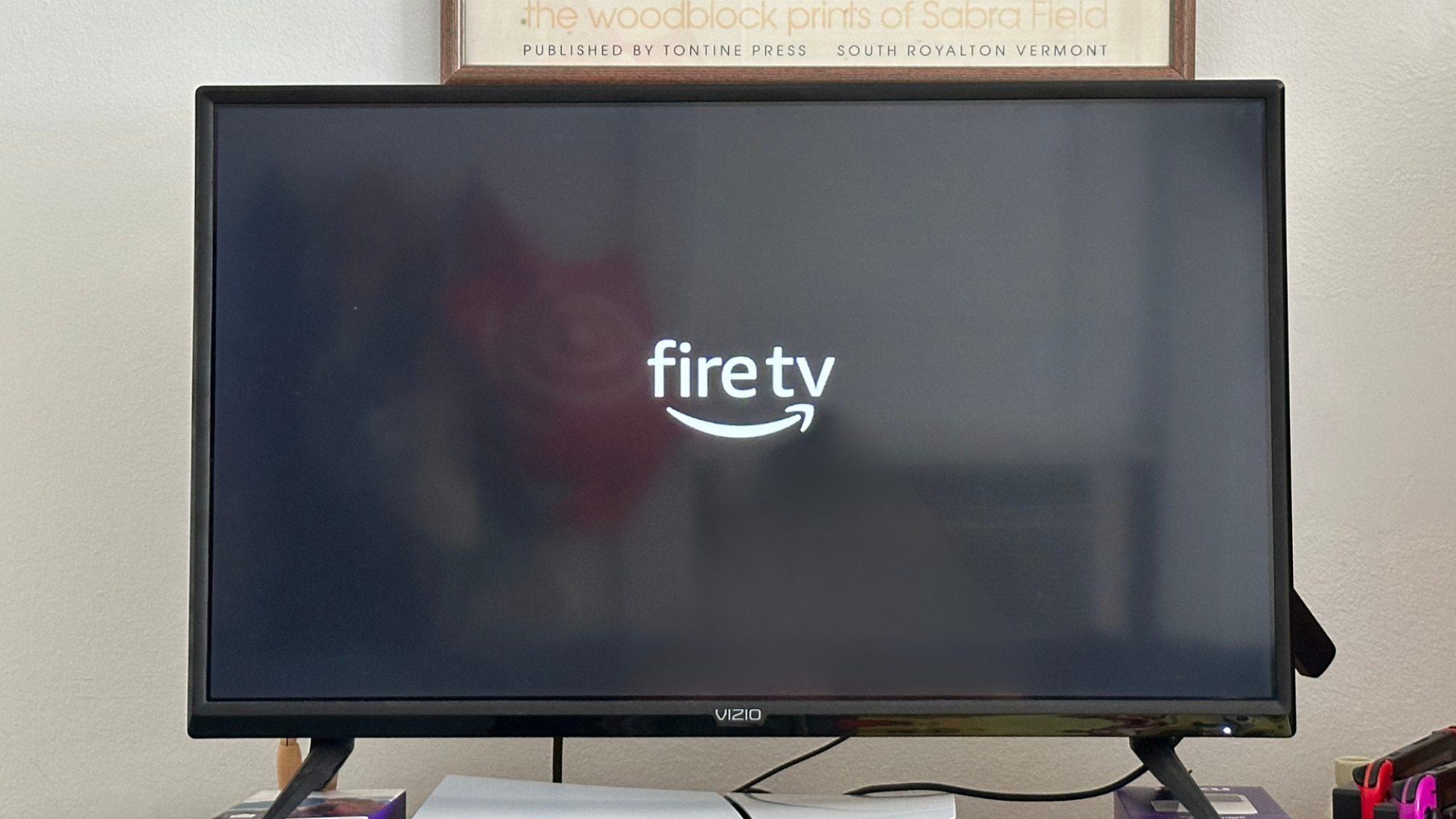 A TV showing the Fire TV logo on the screen.