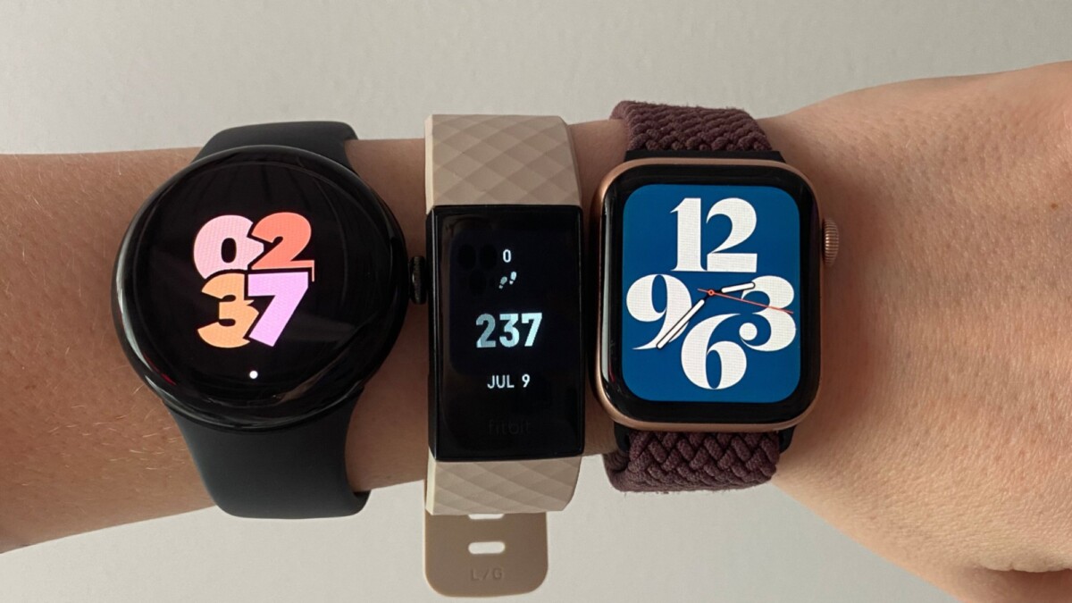 woman's wrist wearing google pixel watch 2, fitbit charge 4, and apple watch series 4