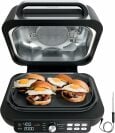 Ninja air fryer with lid open and four sandwiches on griddle