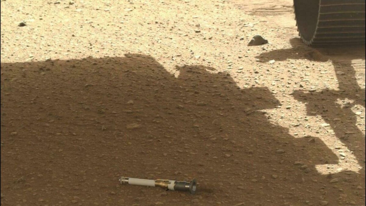 Perseverance dropping a Mars sample tube