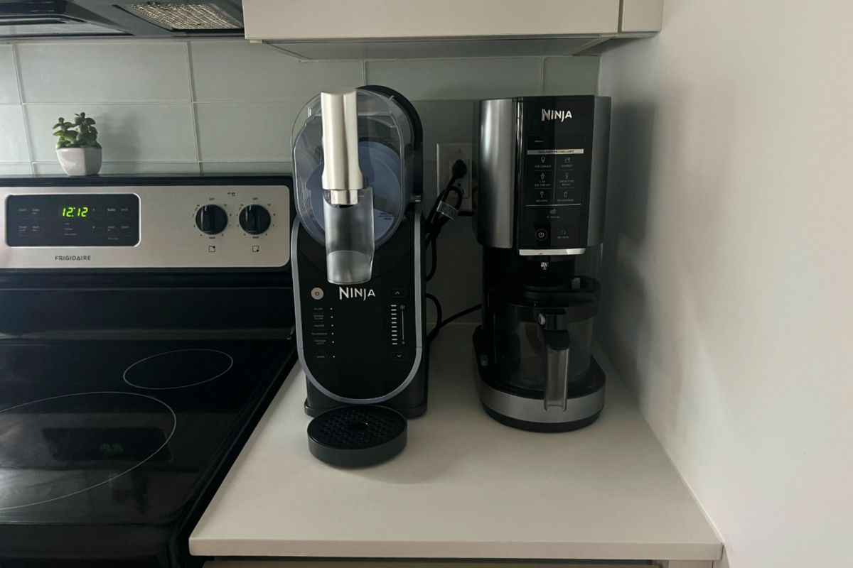 Ninja Slushi and Ninja Creami appliances sitting on countertop beside stove