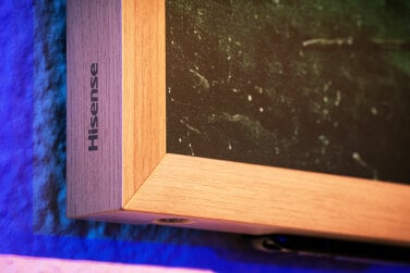 Hisense logo on corner of teak frame