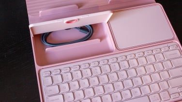 inside of logitech casa showing keyboard, mouse pad, and storage space