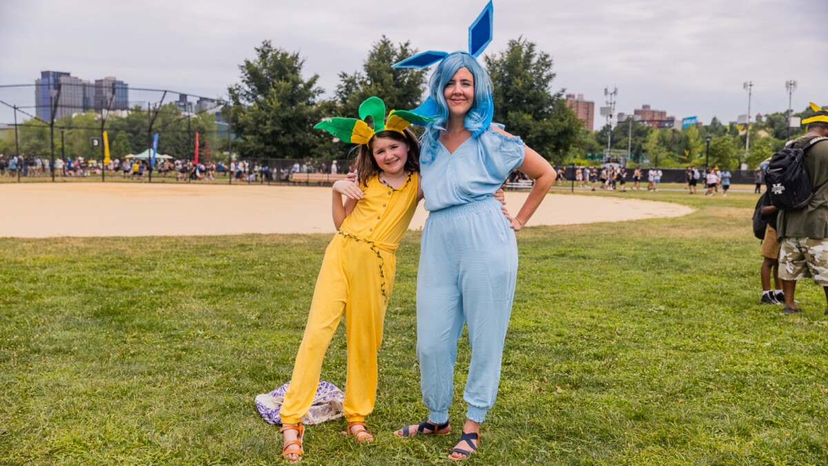 A mother and daughter stand side by side.