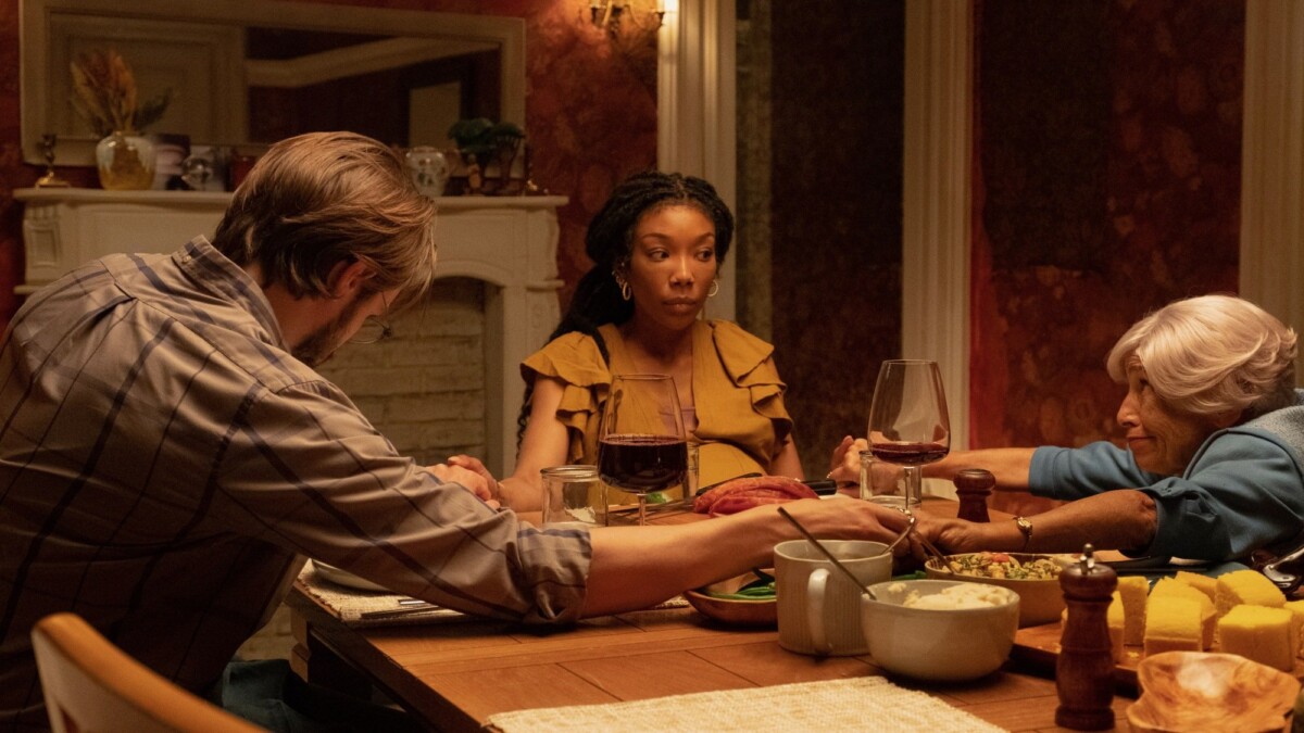 Brandy Norwood, Andrew Burnap, and Kathryn Hunter gather around the dinner table in "The Front Room."