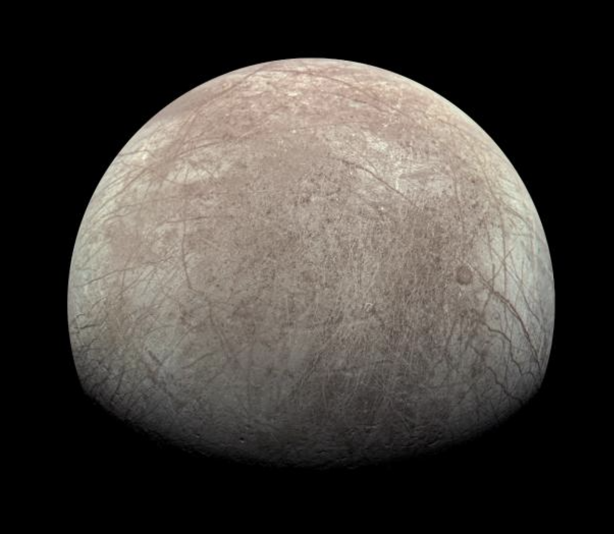 Europa's cracked, icy surface as captured by the Juno spacecraft in 2022.