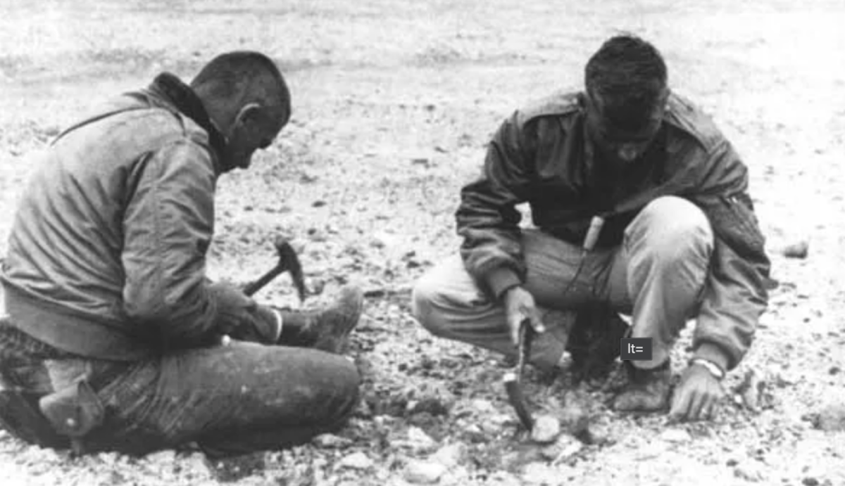 NASA astronauts in the 1960s investigating volcanic rocks in the Valley of Ten Thousand Smokes.