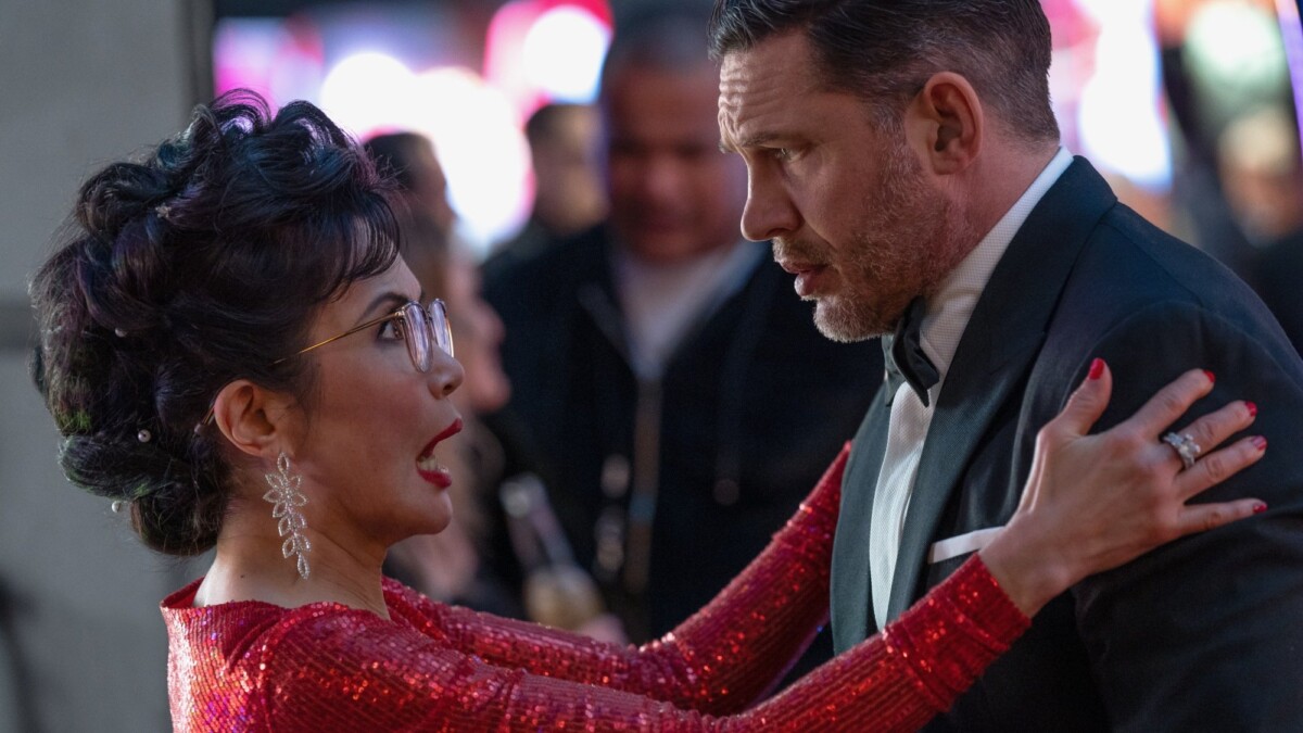 Mrs. Chen (Peggy Lu) is suprised to see Eddie (Tom Hardy) in Columbia Pictures' "Venom: The Last Dance."