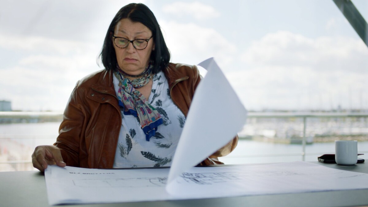 Lt. Commander Ditte Dyreborg, Danish Navy looking at drawings of the Submarine UC3 Nautilus