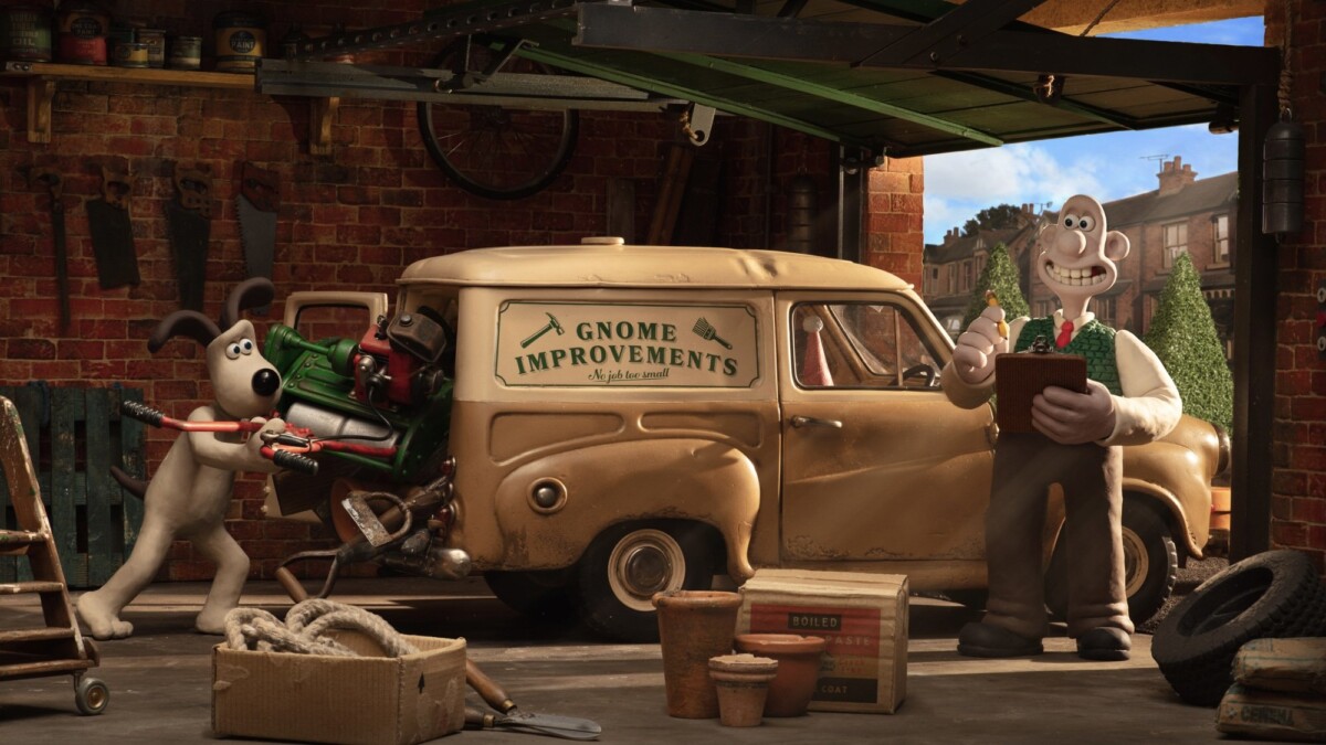 Wallace and Gromit load up a van with garden tools.