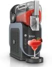 Ninja Slushi frozen drink maker with red drink dispensed into margarita glass