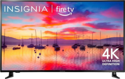 a 55-inch insignia TV displaying a marina with sailboats at sunet