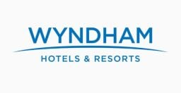 The Wyndham Hotels & Resorts logo appears on a gray background.