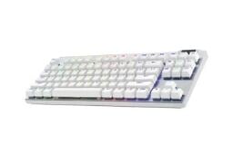 A white keyboard with colorful details appears on a white background.