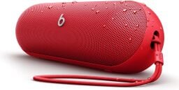 A red Beats Pill speaker that looks like a pill appears on a white background.