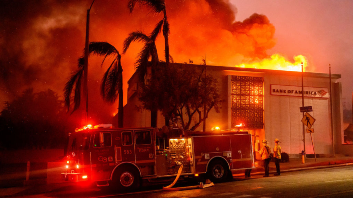 A Bank of America is fully engulfed in flames along Lake Ave. during the Eaton fire in the Altadena area of Los Angeles county, California on January 8, 2025.