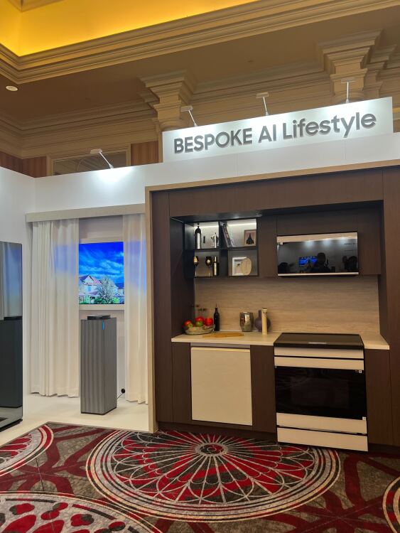 A row of home appliances on a conference floor.