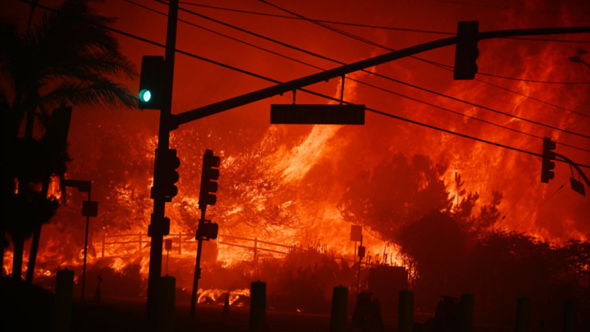 Flames overtake the intersection of Temescal Canyon and Pacific Coast Highway Fire at the Palisades Fire in Pacific Palisades California on January 7, 2025.