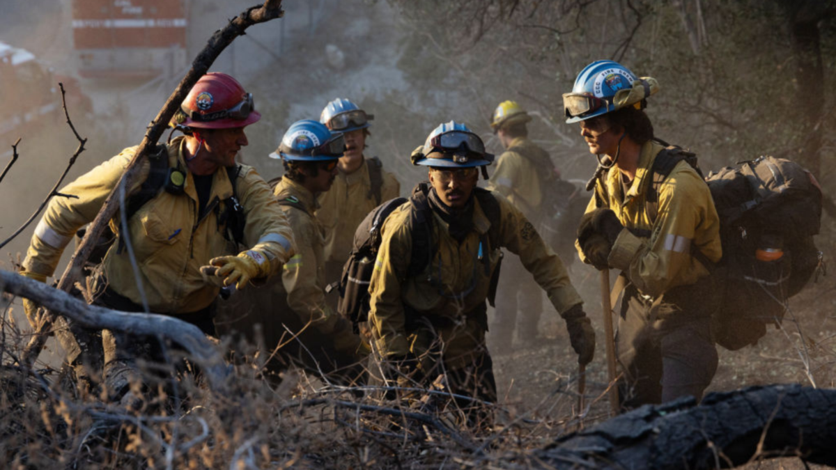 Firefighters from the California Conservation Corps work to contain the Eaton Fire in Altadena, California, US, on Monday, Jan. 13, 2025.