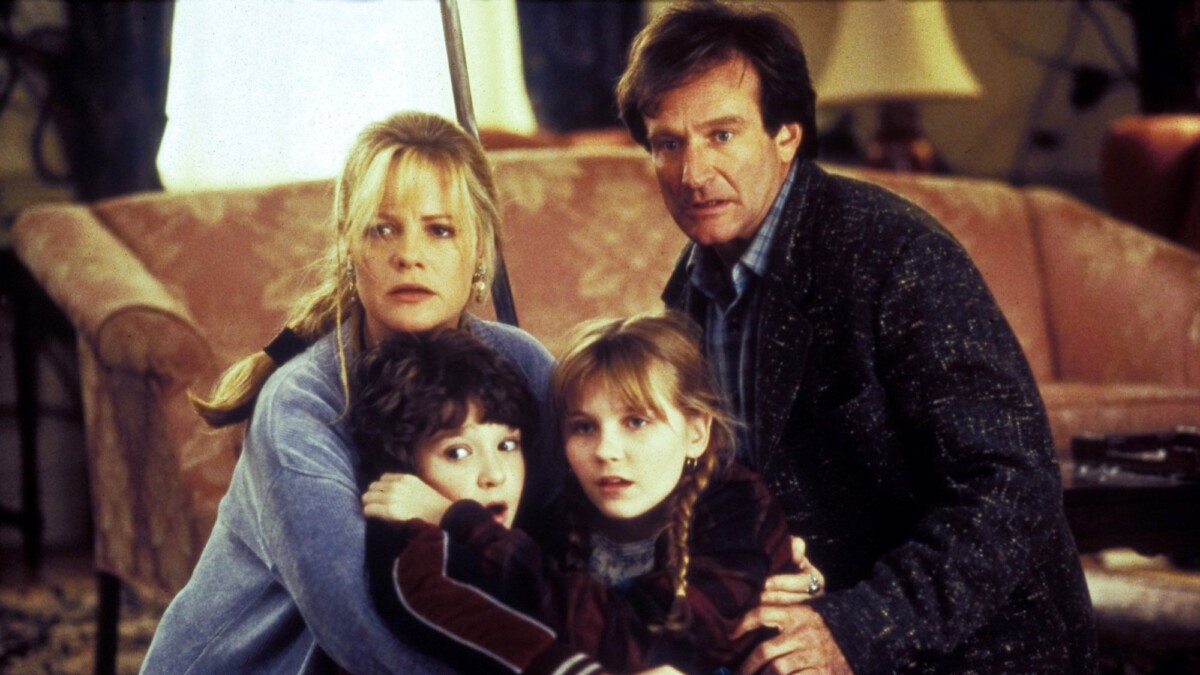 Robin Williams, Kirsten Dunst, Bonnie Hunt, and Bradley Pierce play a game in "Jumanji" (1995).